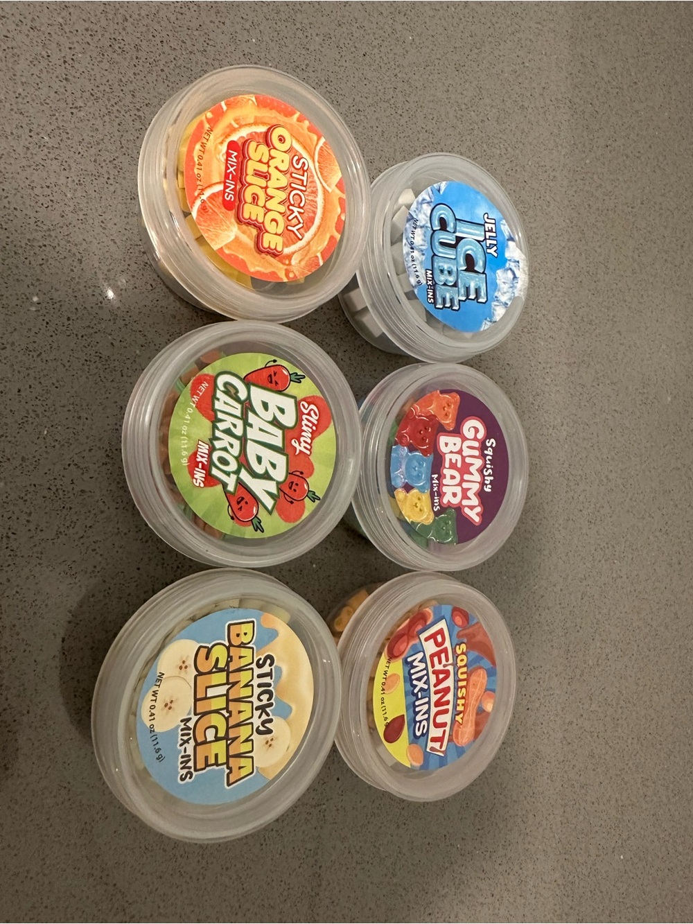 Assorted Slime mix-ins - Oranges, ice cube, peanuts, gummy bears, bananas